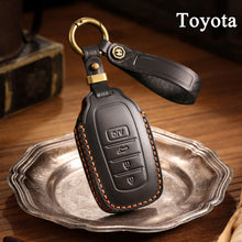 Load image into Gallery viewer, Genuine Leather Key Fob Cover for Toyota Tundra, Sequoia, Sienna, Camry, Corolla, Highlander, Prius Prime, RAV4 Prime, C-HR